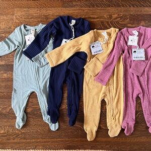 Kate Quinn Ribbed Baby Bodysuits in Berry, light blue, Mustard, and Navy